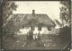 Ingeborg Kirstine Stenger (nee Schmidt) in front of the house in Gammelby, Vodder Parish.